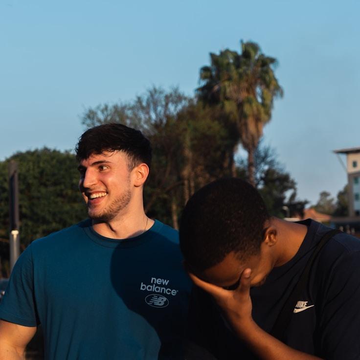 Avery Reed, Lead Design Curator at Stable Horizon Route, reviewing corporate floral arrangements